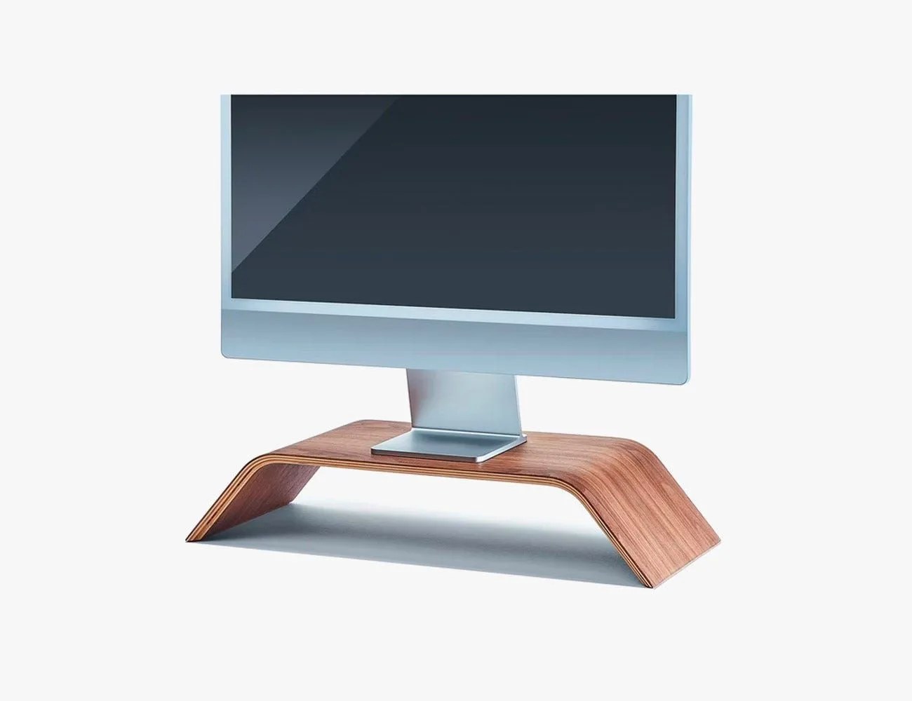 a computer monitor on a wooden shelf