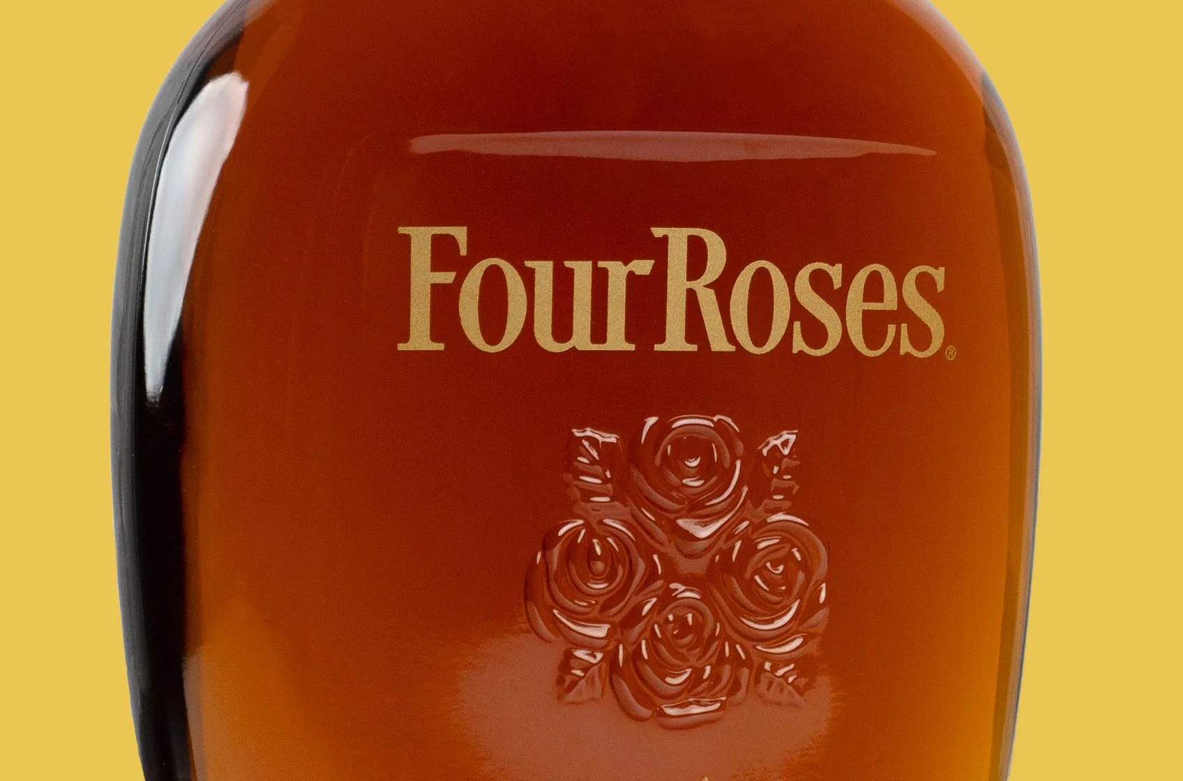 Close up of FourRoses label printed on a glass bourbon bottle