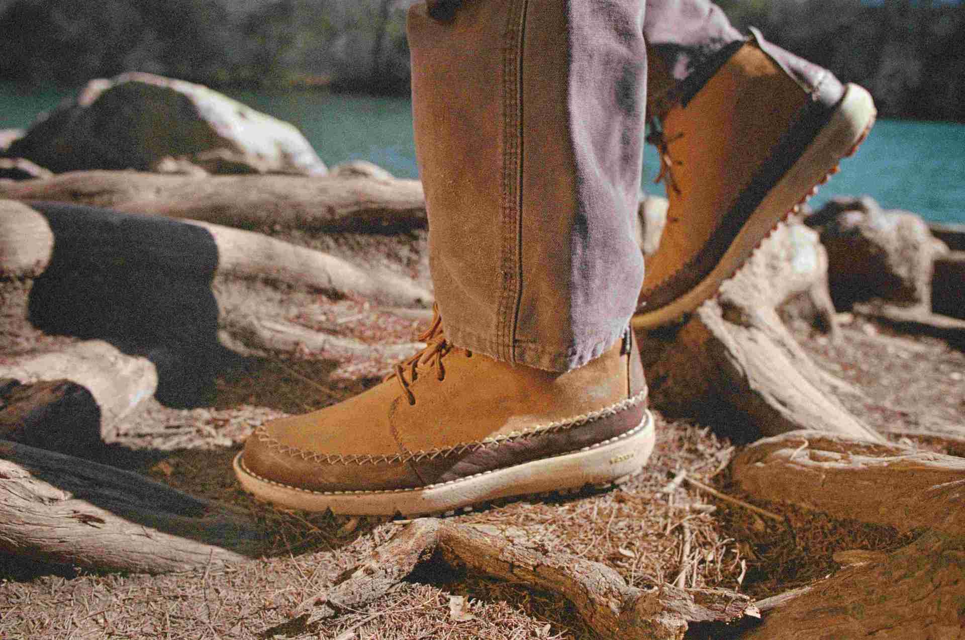 man wearing Huckberry x Danner Mountain Moc 917 boots on rugged trail