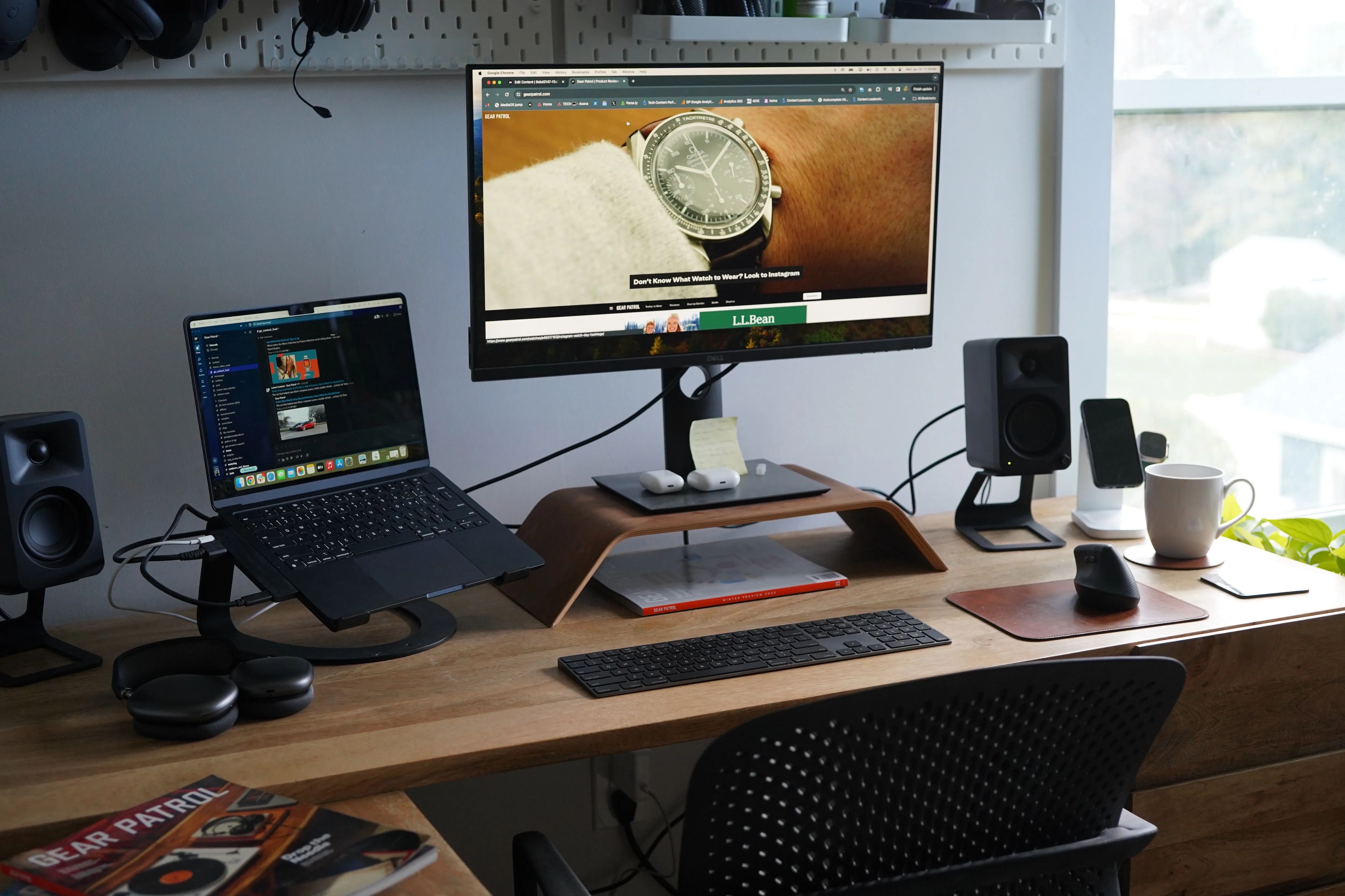 a laptop and a desktop computer on a desk