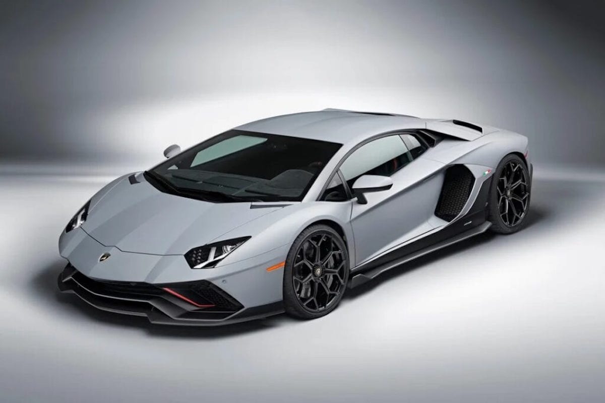 A view of a silver Lamborghini Aventador LP780-4 Ultimae, in studio lighting.