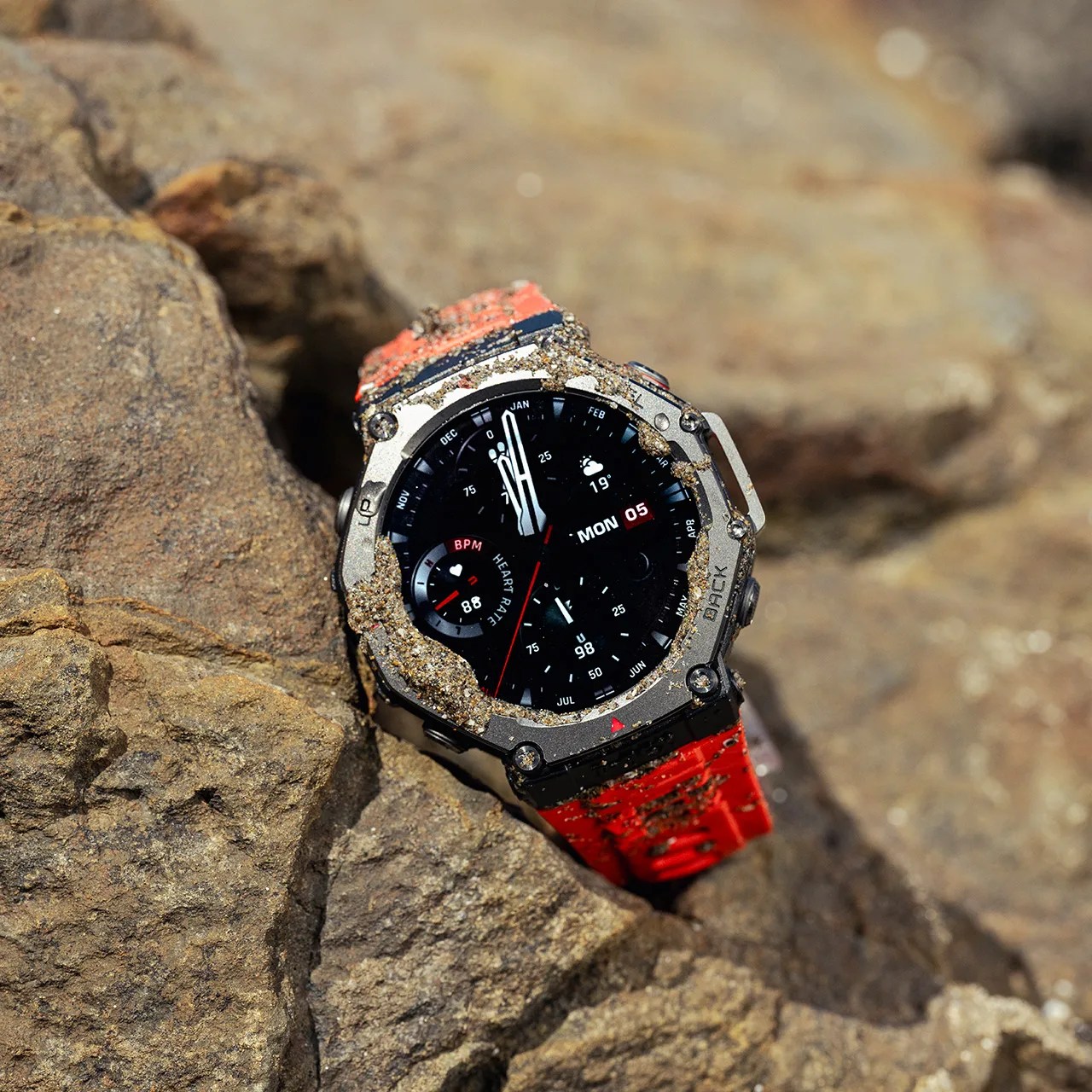 digital watch on rocks