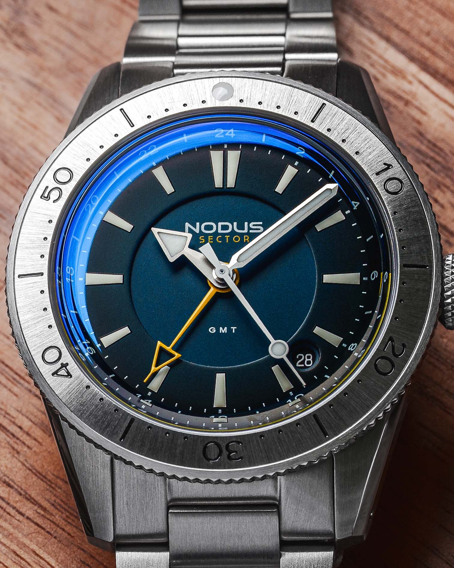 a steel dive watch with a blue dial